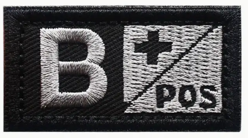 B + Pos - Svart - Silver - Patch