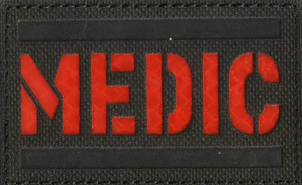 Medic tygmärke svart och röd